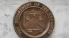 FILE - The Department of the Treasury's seal is seen outside the Treasury Department building in Washington, May 4, 2021. 