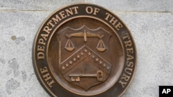 FILE - The Department of the Treasury's seal is seen outside the Treasury Department building in Washington, May 4, 2021. 