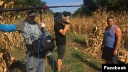 Romanian filmmaker Mihai Dragolea, center, shoots an interview for a documentary, in a photo posted on his Facebook page Sept. 28, 2021.