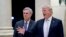 FILE - President Donald Trump, right, accompanied by House Majority Leader Kevin McCarthy, R-Calif., speaks to members of the media as they arrive for a dinner at Trump International Golf Club in West Palm Beach, Florida, Jan. 14, 2018. 