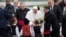 Pope Francis is welcomed by children wearing traditional dresses upon his arrival in Sofia, Bulgaria, May 5, 2019. Pope Francis is visiting Bulgaria, the European Union's poorest country and one that taken a hard line against migrants, a stance that confl