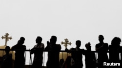 Coptic Orthodox Christians celebrate Palm Sunday in the Samaan el-Kharaz Monastery, in the Mokattam Mountain area of Cairo