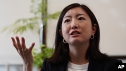 Lawyer Akiko Ozawa, whose law firm advises job-leavers although usually it represents companies, speaks during an interview with The Associated Press on June 22, 2023, in Tokyo. (AP Photo/Eugene Hoshiko)