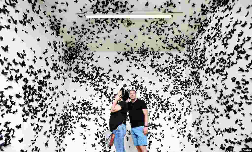 People look at artwork at the Stedelijk Museum, which reopened after the ease of the lockdown measures during the coronavirus disease (COVID-19) outbreak, in Amsterdam, Netherlands.