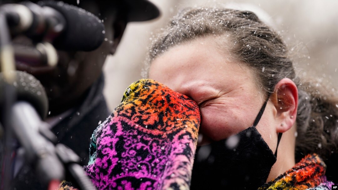 Katie Wright, mother of Daunte Wright, cries as she speaks during a news conference in snowfall, April 13, 2021, in Minneapolis. Daunte Wright, 20, was shot and killed by police Sunday after a traffic stop in Brooklyn Center.