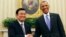 U.S. President Barack Obama (R) shakes hands with Vietnam's President Troung Tan Sang in the Oval Office of the White House, July 25, 2013. 