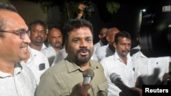 Anura Kumara Dissanayake, the presidential candidate from National People's Power, speaks to the press as he heads to the Election Commission, a day after the presidential election, in Colombo, Sept. 22, 2024.