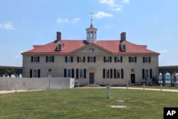 George Washington's residence undergoes a $40 million revitalization project in Mount Vernon, Va., on June 17, 2024. Earlier this year, 18th-century glass bottles containing fruit were found in the Mansion cellar of America's first president. (AP Photo/Nathan Ellgren)