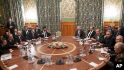 Turkish Foreign Minister Mevlut Cavusoglu (3-L), Turkish Defense Minister Hulusi Akar (2-L), Russian Foreign Minister Sergey Lavrov (4-R), and Russian Defense Minister Sergei Shoigu (3-R) attend talks in Moscow, Russia, Jan. 13, 2020.