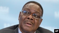 FILE - Malawi's President Peter Mutharika meets with reporters at the conclusion of the US-Africa Summit at the Institute of Peace in Washington.