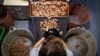 An employee selects the high quality corks at the Amorim cork factory in Mozelos, near Santa Maria da Feira, north of Portugal on Sept. 10, 2024. 