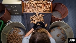 An employee selects the high quality corks at the Amorim cork factory in Mozelos, near Santa Maria da Feira, north of Portugal on Sept. 10, 2024. 