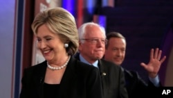 FILE - Democratic presidential candidates Hillary Clinton, Bernie Sanders and Martin O'Malley take the stage for a debate in Des Moines, Iowa, Nov. 14, 2015. Sanders now has a slight lead in the latest Quinnipiac University poll.