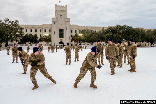 Citadel cadets engage in a snowball fight during a very rare snow day to their campus on Wednesday Jan. 22, 2025 in Charleston, S.C.