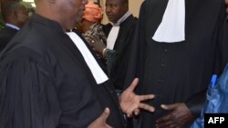 Souley Oumarou, one of the lawyers of Hama Amadou, the ex-prime minister of Niger stands outside the court following a hearing related to baby trafficking charges against his client in Naimey on January 2, 2015. The Trial alledging former parliamentary 