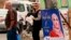 A poster of a woman candidate for parliamentary elections is seen at a bus stop in Baghdad, Iraq, April 22, 2018.