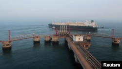 FILE: A liquified natural gas (LNG) tanker leaves the dock after discharge at PetroChina's receiving terminal in Dalian, Liaoning province, China on July 16, 2018.
