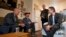 Gov. Gavin Newsom, right, visits veteran Vern Davis, second from left, during his tour of the Mather Veterans Village in Rancho Cordova, California, Dec. 5, 2019. 