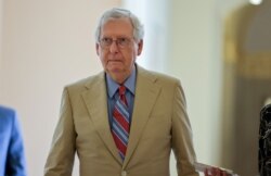 FILE - U.S. Senate Minority Leader Mitch McConnell, R-Ky., walks to the Senate floor on Capitol Hill in Washington, June 14, 2021.