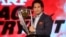 Former Indian cricketer and brand ambassador of the International Cricket Council's (ICC) Cricket World Cup 2015 Sachin Tendulkar holds the ICC Cricket World Cup 2011 trophy during a promotional event in Mumbai, India, Feb. 7, 2015. 