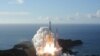 Handout photo shows an H-2A rocket carrying the Hope Probe lifts off from the launching pad at Tanegashima Space Center on the island of Tanegashima, Japan