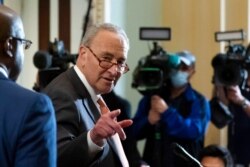 Senate Majority Leader Chuck Schumer of New York speaks with reporters as the Senate prepares for a key test vote on the For the People Act, a sweeping bill that would overhaul the election system and voting rights, at the Capitol, June 22, 2021.