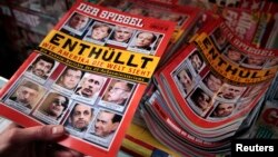 FILE - A customer buys an issue of 'Der Spiegel' magazine at a kiosk in Hamburg, Germany, Nov. 29, 2010. The publication recently pulled its reporter, Hasnain Kazim, out of Turkey amid signs he is no longer welcome there.