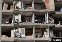 FILE - A damaged building is seen following an earthquake in Sarpol-e Zahab county in Kermanshah, Iran. Nov. 13, 2017.
