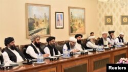 FILE - Mullah Abdul Ghani Baradar (3rd-L), who is leading a Taliban delegation, attends a meeting at the Ministry of Foreign Affairs in Islamabad, Pakistan, Oct. 3, 2019.