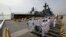 A Philippine Navy Band plays as the Russian Navy vessel Admiral Tributs, a large anti-submarine ship, docks at Manila's pier, Philippines, Jan. 3, 2017. Two Russian Navy Vessels are in the country for a goodwill visit until Jan. 7.