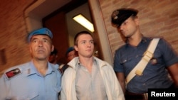 FILE - Raffaele Sollecito (C) arrives in court for his appeal trial session in Perugia, Sept. 26, 2011. 