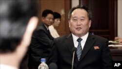 FILE - Ri Son Gwon talks with South Korean Unification Minister Cho Myoung-gyon, during a meeting at the northern side of Panmunjom in the Demilitarized Zone, North Korea, Aug. 13, 2018.