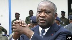 Ivory Coast's President Laurent Gbagbo attending an official funeral ceremony in Abidjan (File)