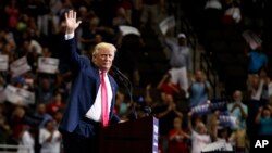 Republican presidential candidate Donald Trump waves after speaking at a rally Aug. 3, 2016, in Jacksonville, Fla.