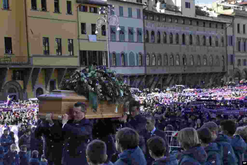 The coffin of&nbsp;Italian player Davide Astori is carried into the church in Florence. The 31-year-old Astori was found dead in his hotel room on Sunday after a suspected cardiac arrest before his team was set to play an Italian league match at Udinese.