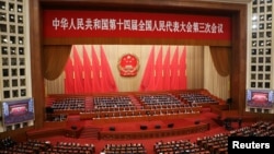 A general view of Chinese officials and delegates attending the closing session of the National People's Congress at the Great Hall of the People in Beijing, March 11, 2025.