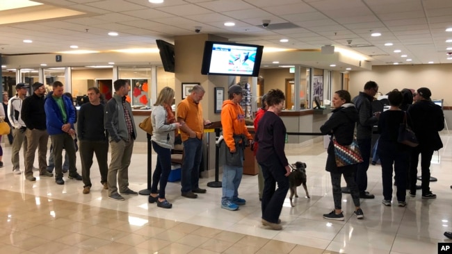 Voters wait in line at Boise City Hall in Boise, Idaho, to cast ballots in early voting, Nov. 2, 2018. An unusually high number of Idahoans have voted early, and two high-profile ballot initiatives appear to be driving some of the turnout.