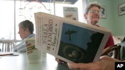 Sandra Lindley, right, and Lydia Kuhn listen to a reading of "To Kill a Mockingbird" on March 6, 2006, in Fresno, Calif.