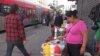 Guadalupe Santiago sells hot dogs from a small cart in Los Angeles, California. Once the city sets regulations for vending permits, she plans to upgrade equipment or meet any other requirements. (A. Martinez/VOA)