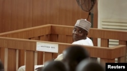 FILE - Nigeria Senate President Bukola Saraki looks on from the dock at the Code of Conduct Tribunal at Darki Biu, Jabi Abuja, September 22, 2015.