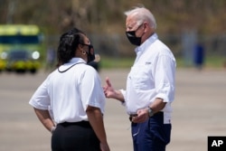 President Joe Biden talks with New Orleans Mayor LaToya Cantrell as he arrives at Louis Armstrong New Orleans International Airport in Kenner, Louisiana, Sept. 3, 2021, to tour damage caused by Hurricane Ida.