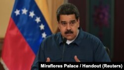 El presidente de Venezuela, Nicolás Maduro, habla durante una reunión con ministros en el Palacio de Miraflores en Caracas el lunes, 13 de agosto de 2018.