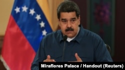 Venezuela's President Nicolas Maduro speaks during a meeting with ministers at the Miraflores Palace in Caracas, Venezuela, Aug. 13, 2018.