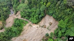 An aerial view shows a road cut off by a landslide that killed at least seven people in Sibolangit, North Sumatra, Indonesia, on Nov. 28, 2024.