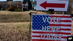FILE - A voting sign is seen near a voting center at Croft Baptist Church, Feb. 24, 2024, in Spartanburg, S.C.