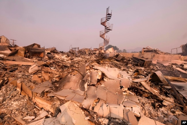 The charred remains of the burned out home are seen in Malibu, Calif., Nov. 10, 2018.