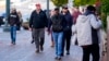 Boeing employees leave after voting on a new contract offer from the company, Nov. 4, 2024, outside the Angel of the Winds Arena in Everett, Wash.