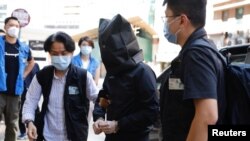 香港警方2021年7月22日对出版“煽动性刊物”嫌疑人展开逮捕行动（路透社）