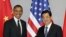 Los presidente Obama y Hu Jintao se estrechan las manos antes de iniciar su encuentro bilateral en Corea del Sur.