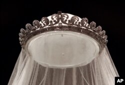 The Cartier "Halo" tiara, worn by the Duchess of Cambridge on her wedding day, is seen in Buckingham Palace in London, July 20, 2011, before it goes on display during the palace's annual summer opening.